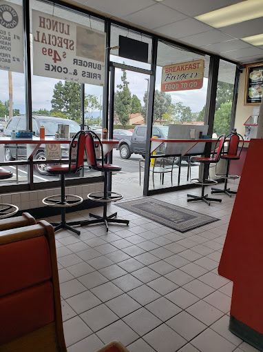 The diner counter at Dippity Donuts, with red vinyl stools